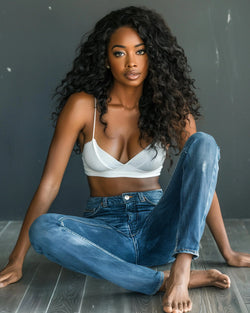 A black woman wearing deep wave hair bundles HookedOnBundles Virgin Hair