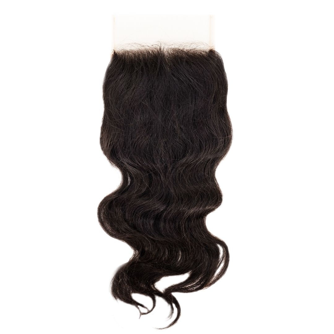Black hair closure with wavy texture on a white background HookedOnBundles Virgin Hair