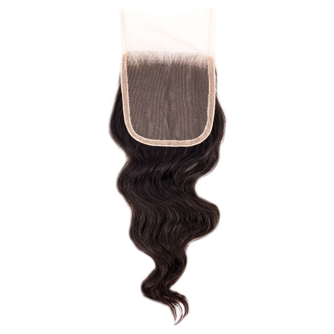 Black wavy hair closure on a white background HookedOnBundles Virgin Hair