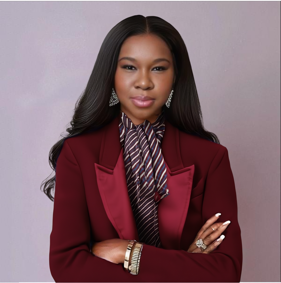 Black woman with long straight virgin hair wearing a burgundy blazer professional portrait HookedOnBundles Virgin Hair HookedOnBundles Virgin Hair